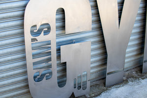 Large Metal Letter with Brackets