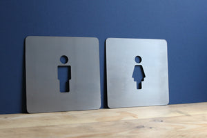 square man and woman toilet signs