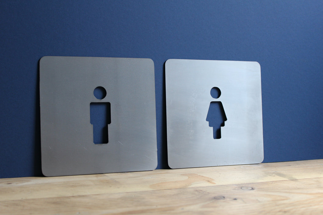 square man and woman toilet signs