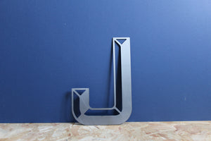 industrial 3D style metal letter