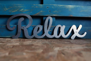 relax metal word sign