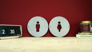round man and woman toilet signs